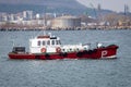 Pilot boat in the harbor. Going to meet a cargo ship