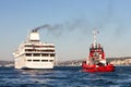 Pilot boat monitors luxury ship Royalty Free Stock Photo