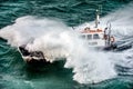 Pilot boat seen from the sky sailing in the middle of a storm Royalty Free Stock Photo