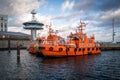 two pilot boats are in the harbor of Luebeck Travemuende