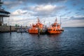 two pilot boats are in the harbor of Luebeck Travemuende