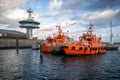 two pilot boats are in the harbor of Luebeck Travemuende