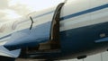 Pilot closes and latches jet airplane hatch