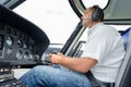 Pilot in cockpit helicopter during flight