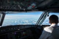 Pilot in a commercial airliner airplane flight cockpit