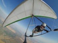 Pilot controls his hang glider wing on hign altitude