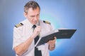 Pilot filling in logbook and checking papers Royalty Free Stock Photo