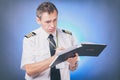 Pilot filling in logbook and checking papers Royalty Free Stock Photo