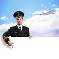 Pilot in the form of holding an empty billboard Royalty Free Stock Photo