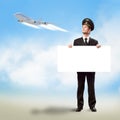 Pilot in the form of holding an empty billboard Royalty Free Stock Photo