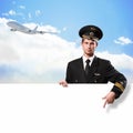 Pilot in the form of holding an empty billboard Royalty Free Stock Photo