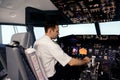 A Pilot hand is controlling plane to fly take off and landing