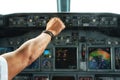 Pilot hand operate a switch on aircraft panels. Royalty Free Stock Photo