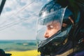 Pilot with a helmet flying the modern airplane in sunny sky Royalty Free Stock Photo