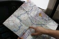 Pilot navigating in small aicraft using map Royalty Free Stock Photo