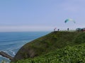 Pilot in a no engine paraglider is ready to fly in Lima