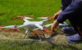 Pilot, operator adjusts Drone with high resolution digital camera.