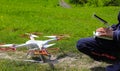 Pilot, operator adjusts Drone with high resolution digital camera.