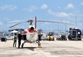 The pilot is preparing a helicopter for live broadcasting of the Grand Prix motorcycle racing