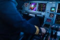 Pilot`s hand accelerating on the throttle in a commercial airliner