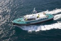 Pilot ship escorting Oceania Cruise ship out of port