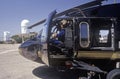 A pilot sitting in the cockpit of the Night Hawk helicopter used by the U.S. Customs Department at a Kitt Peak, Arizona, heliport