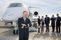 Pilot standing in front of corporate private jet Royalty Free Stock Photo