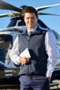 Portrait Of Pilot Standing In Front Of Helicopter With Digital T Royalty Free Stock Photo