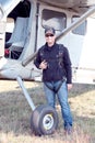 Pilot standing next to his X328 Atlas Angel Turbine specially equipped aircraft for sky divers