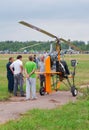 Pilot tells the spectators about his autogyro