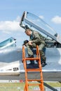 The pilot and the visitor near the cockpit of the multirole fighter Mikojan-Gurewitsch MiG-29.