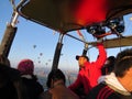 The pilot who controls the balloon. Tourists fly over the surroundings of the village