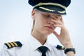 Pilot worker at the airport tired and stressed out from work. Money problems Royalty Free Stock Photo