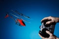 Piloting remote control helicopter Royalty Free Stock Photo