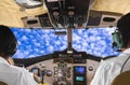 Pilots in the plane cockpit and sky Royalty Free Stock Photo