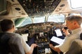 Pilots preparing aircraft for take-off Royalty Free Stock Photo