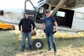 Pilots standing next to one of two X328 Atlas Angel Turbine spec