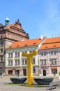 Pilsen, Czech Republic - June 25, 2019: The main square in Plzen, Czechia with golden water fountain. Historical buildings and