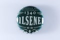 Pilsener 1340 lid, beer cap, white background Royalty Free Stock Photo