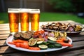 pilsner beer and grilled veggies arranged for a feast