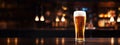 Pilsner glass of light beer on bar table in a dark pub with copy space. Generative AI Royalty Free Stock Photo