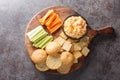 Pimento or pimiento cheese is a spread made of cheese, mayonnaise and pimientos and served on crackers and vegetables closeup on