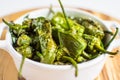 Fried Green Padron Peppers in White Bowl