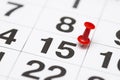 Pin on the date number 15. The fifteenth day of the month is marked with a red thumbtack. Pin on calendar Royalty Free Stock Photo