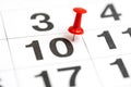 Pin on the date number 10. The tenth day of the month is marked with a red thumbtack. Pin on calendar. Calendar concept for Royalty Free Stock Photo