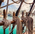 Pin rail with fixed ropes. An old sailing ship Royalty Free Stock Photo