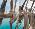 Pin rail with fixed ropes. An old sailing ship Royalty Free Stock Photo