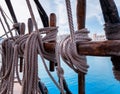 Pin rail with fixed ropes. An old sailing ship Royalty Free Stock Photo