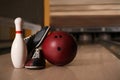 Pin, shoes and ball on alley in bowling club Royalty Free Stock Photo