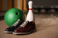 Pin, shoes and ball on alley in bowling club Royalty Free Stock Photo